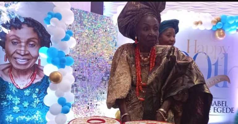 Dame Mabel Bamidele Egede cutting her 80th Birthday