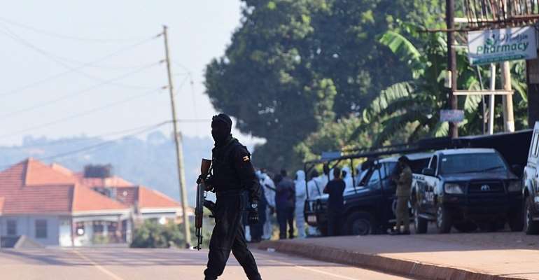 Ugandan police members secure a scene in Komamboga, Uganda in October 2021. Uganda's constitutional court on January 10, 2022, struck down Section 25 of the country's Computer Misuse Act, which criminalized 'offensive communication.