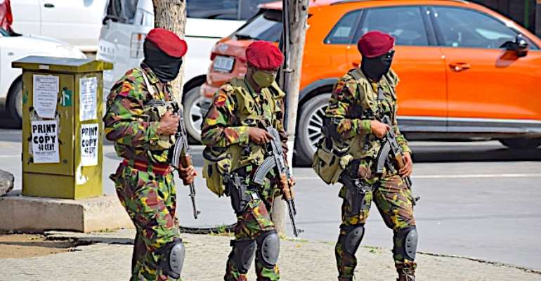 Lesotho soldiers on patrol as seen in Maseru, Lesotho, on January 29, 2021. Authorities in the city arrested a journalist, suspended a radio station's license, and raided another. (AFP/Molise Molise)