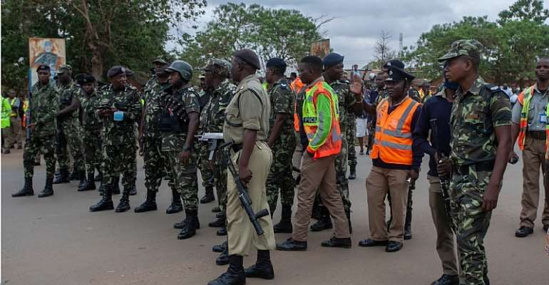 Police officers stand in a line during a demonstration in Lilongwe, Malawi, on November 26, 2021. Officers seized the phone of Zodiak Broadcasting Station reporter Raphael Mlozoa while he was photographing an anti-government demonstration on November 30, 