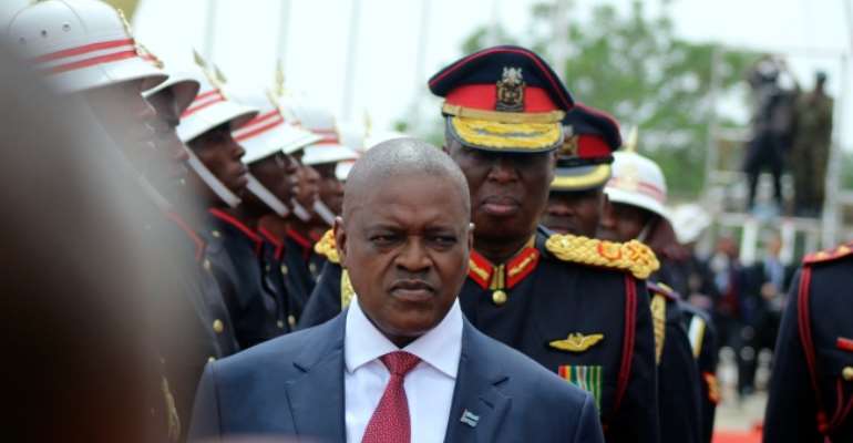 Botswana President Mokgweetsi Masisi inspects a guard of honor at a ceremony in Gaborone, Botswana, on November 1, 2019. Masisi's government has proposed a bill that could allow warrantless surveillance of journalists. (AP/Sello Most)