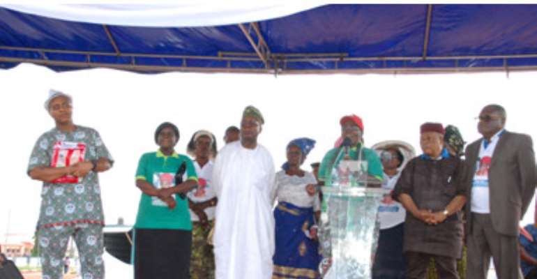 L-R: Rev. Prof.) Alex Akpodiete (left), Engr. Dele Uduehi (4th left), governorship aspirant Dr. Esther Uduehi (at the podium), Gen. Philip Onyekwele (2nd right), Prof. Osakwe, former SSG Dr. Mrs. Beatrice Omeni (behind Gen.).