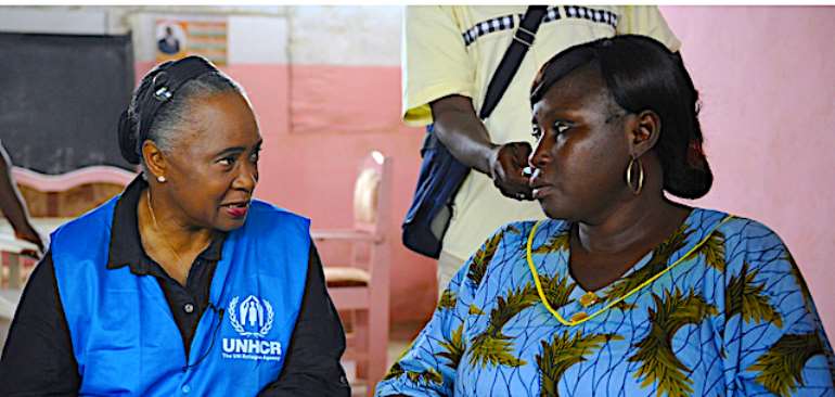 US opera singer and goodwill ambassador for the UNHCR Barbara Hendricks (L) speaks with a stateless woman on June 26, 2014 in a neighborhood of Abidjan during her visit to Ivory Coast.