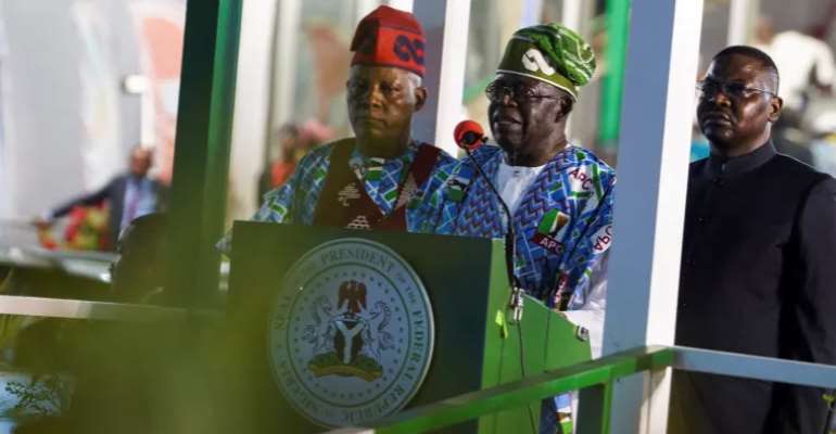 Nigeria's President Bola Ahmed Tinubu delivers a speech as Vice President Kashim Shettima stands beside him in Abuja on March 27. CPJ and five other rights groups have called on Tinubu to take action to protect the press ahead of elections