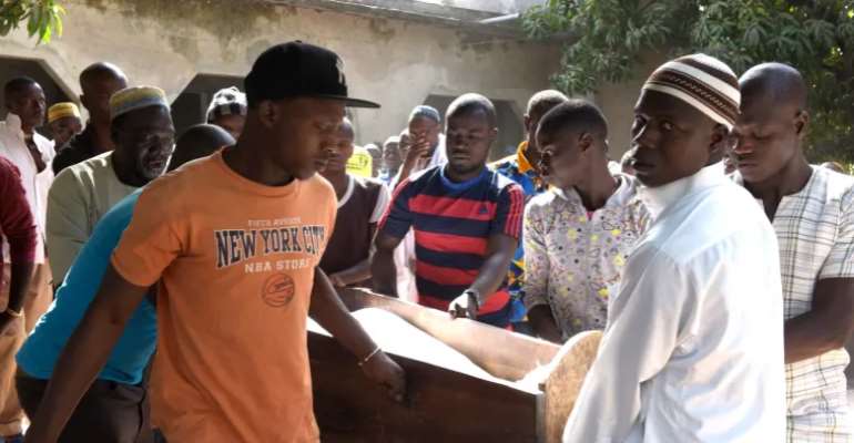Men prepare to bury one of 14 illegal loggers killed on January 6, 2018. A Casamance court found RenÃ© Capain BassÃ¨ne guilty of complicity in murder, attempted murder, and criminal association for the execution of the 14 men. (Photo: AFP/Seyllou) /  
