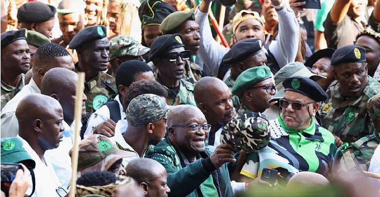 Former South African president Jacob Zuma arrives at a rally in Soweto on May 18, 2024, to launch the manifesto of his new political party, uMkhonto we Sizwe, ahead of South Africa's May 29 general election. Men wearing military fatigues assaulted 