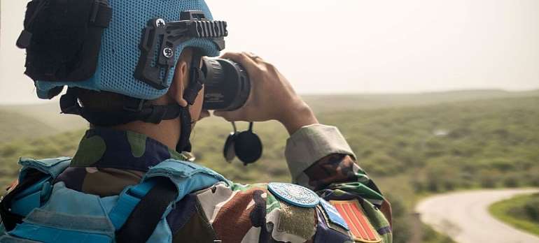 UNIFIL/Kandice Ardiel: A peacekeeper monitors the Green Hill area in Naqoura, Lebanon