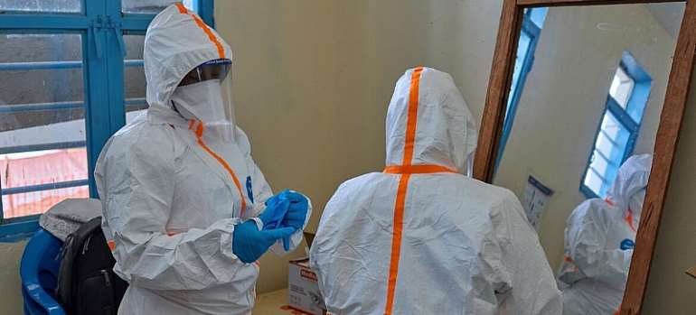 WHO Health workers prepare for work at a newly-opened Ebola treatment centre in Bunia, DR Congo