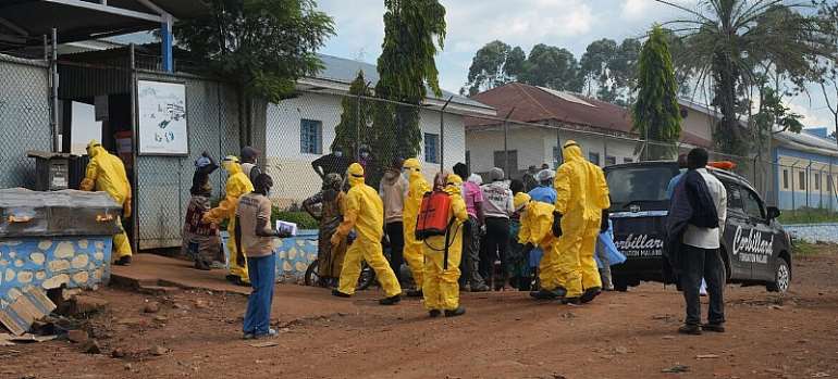 WHO/JoÃ«l Lumbala: Health teams in personal protective equipment (PPE) respond to the Ebola outbreak in eastern DR Congo
