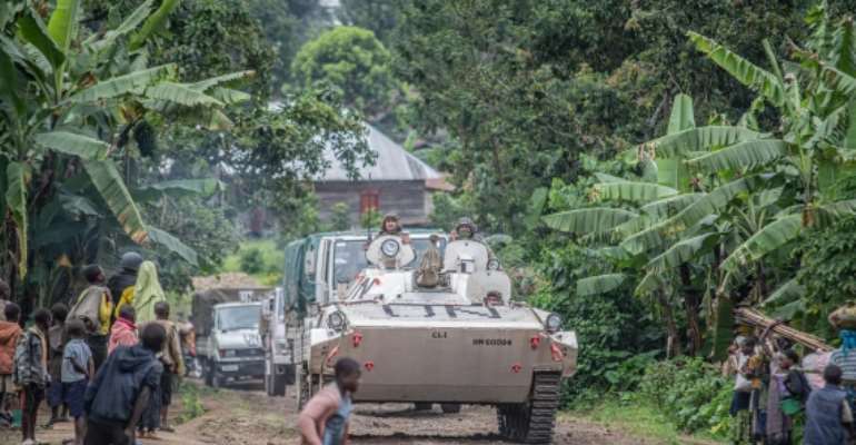 UN troops are seen near Kibumba, north of Goma, the Democratic Republic of Congo, on January 28, 2022. M23 rebels in the eastern Congo recently looted a radio station in Bunagana. (AP/Moses Sawasawa)