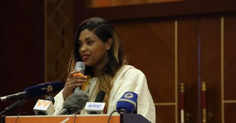 Ethiopian journalist Salsawit Baynesagn speaks at an International Women's Day event on March 8, 2021, in Addis Ababa. She was detained at her home in the capital on June 8, 2026. (Screenshot: Ethiopia's Ministry of Culture/YouTube)