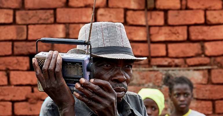  A displaced Congolese man listens to the radio outside his shelter in South Kivu province in January. Journalists have been targeted for reporting on the latest clashes. (Photo: Reuters/Gradel Muyisa Mumbere)