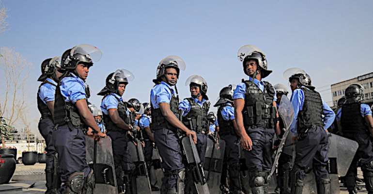 Police officers are seen in Addis Ababa, Ethiopia, on June 19, 2021. Officers recently arrested more than a dozen employees of two media outlets in the city. (Reuters/Tiksa Negeri)