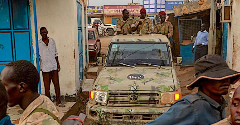 Security forces are seen in Juba, South Sudan, on April 9, 2020. Authorities recently detained journalist Alfred Angasi and have held him for weeks without charge. (AFP/Alex McBride)