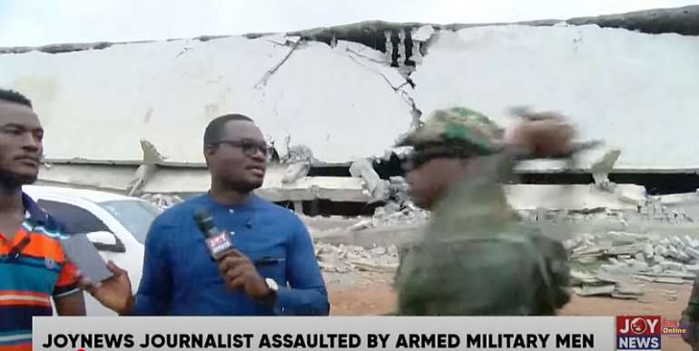 A military officer takes a swing during an interview by a Joy News journalist. (Screenshot: Joy News/YouTube)