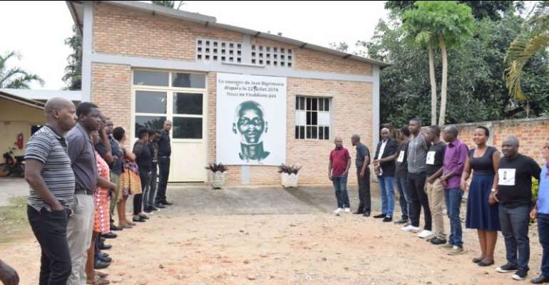 Iwacu staff and supporters commemorate the 2016 disappearance of their colleague Jean Bigirimana, whose picture hangs outside the Iwacu office in Bugarama, as pictured in July 2020. (Photo: Iwacu)