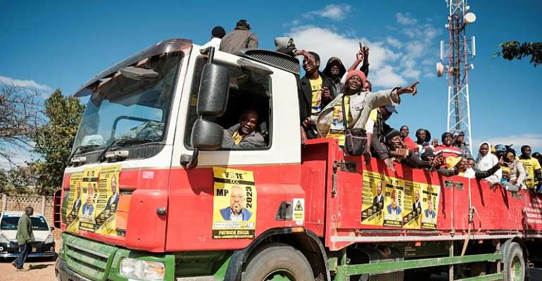 Supporters of Zimbabwe's main opposition party, the Citizens Coalition for Change (CCC) arrive at an election rally in Gweru, Zimbabwe, July 16, 2023. Zimbabwean reporter Columbus Mavhunga, who has reported on the government crackdown on opposition politi