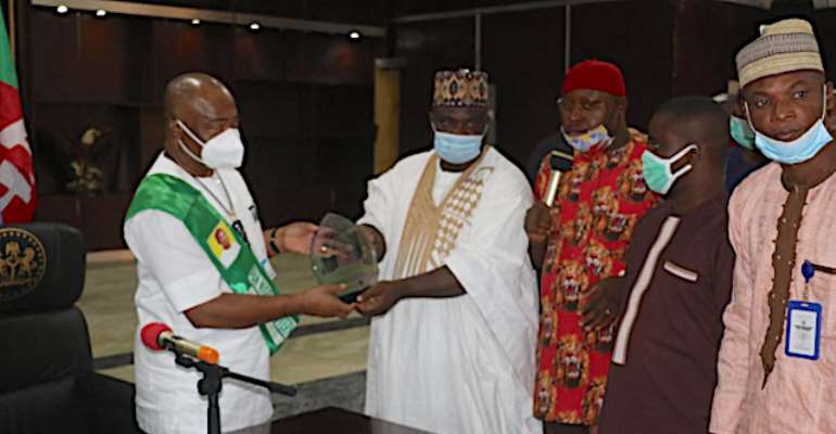 Governor Hope Uzodimma receives an award as Pan-Nigerian Governor of the Year.