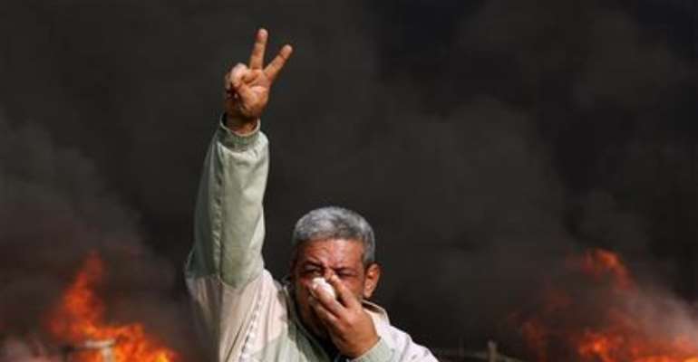 AN EGYPTIAN PROTESTER. PHOTOGRAPH BY REUTERS.