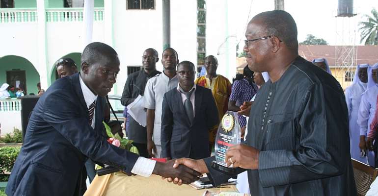 Gov. Peter Obi (right),  receiving the Legend of True Leadership Award from the National President of National Association