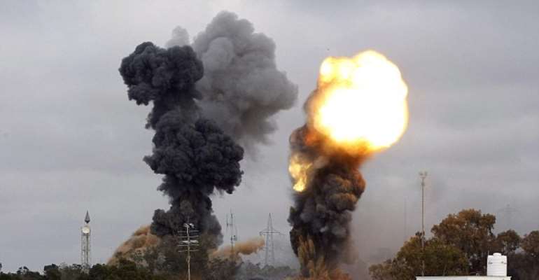 NATO bombs strike Kadhafi's neighborhood (Photo credit MAHMUD TURKIA/AFP/Getty Images)