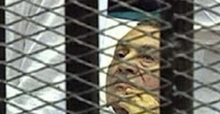 EGYPT'S OUSTED PRESIDENT HOSNI MUBARAK SITS INSIDE A DOCK AT THE POLICE ACADEMY ON THE OUTSKIRTS OF CAIRO APRIL 15, 2013.