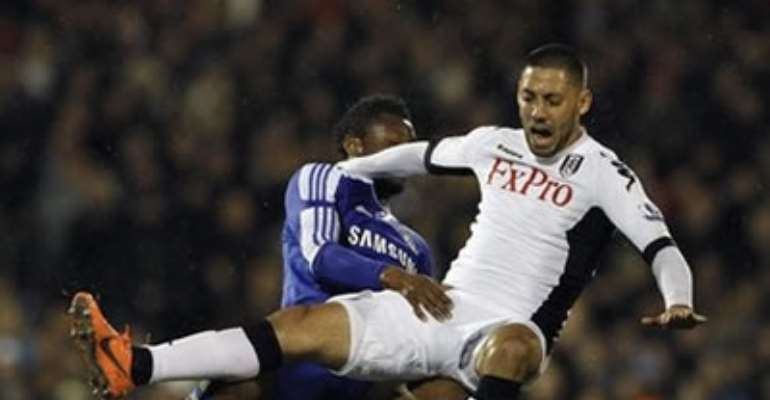 FULHAM'S CLINT DEMPSEY (R) CHALLENGES CHELSEA'S MIKEL DURING THEIR ENGLISH PREMIER LEAGUE SOCCER MATCH AT CRAVEN COTTAGE IN LONDON APRIL 9, 2012
