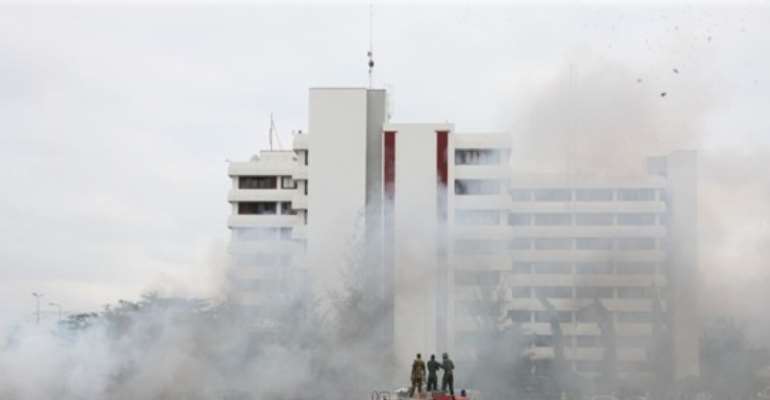 FIRE FIGHTERS AND EMERGENCY RESCUE CREW PUT OUT A FIRE CAUSED BY A BOKO HARAM CAR BOMB INSIDE THE CAR PARK OF THE POLICE HEADQUARTERS, ABUJA IN JUNE, 2011.