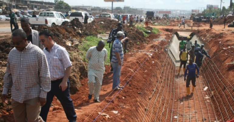 Gov. Obi, inspecting the on-going construction of  the  Headbridge-Upper Iweka road, yesterday