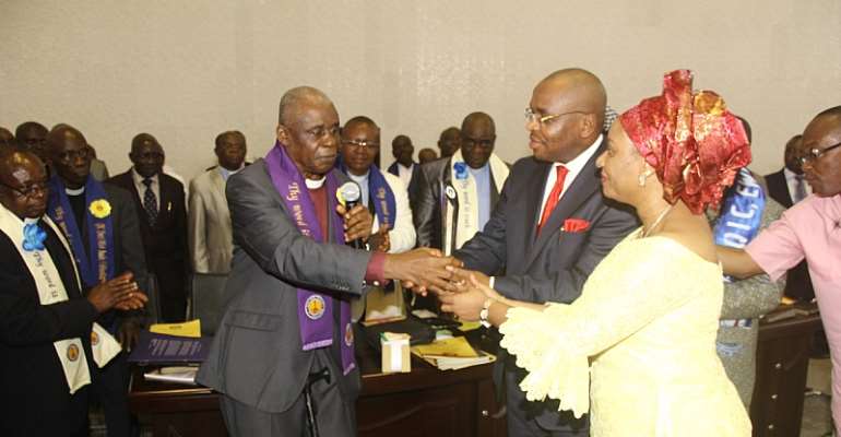 A'Ibom SSG Mr Udom Emmanuel and Wife Martha(R), receiving an excellence award from the fmr Nat'l chairman of Qua Iboe Church, Dr Emmanuel Ossom(L)