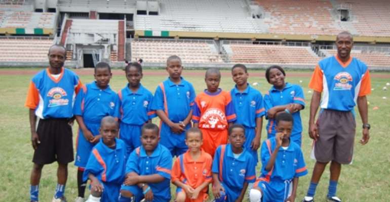 A line-up of under 13 children and their coaches at the ongoing 3-week Summer Camp training for kids organised by Cowbell Football Academy (CFA) at the National Stadium, Surulere, Lagos, recently