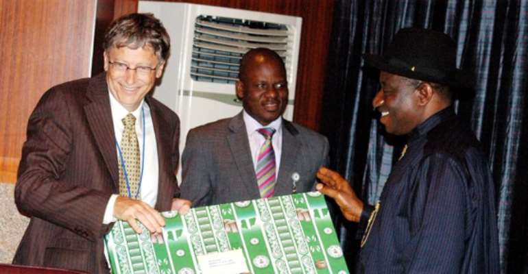 R-L: PRESIDENT GOODLUCK EBELE JONATHAN PRESENTS A GIFT TO VISITING CHAIRMAN OF MICROSOFT AND THE BILL AND MELLINDA GATES FOUNDATION, MR BILL GATES, INSIDE THE PRESIDENTIAL VILLA, ABUJA, THURSDAY, SEPTEMBER 29, 2011.