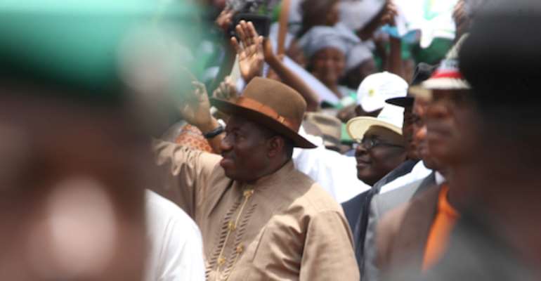 NIGERIAN PRESIDENT GOODLUCK EBELE JONATHAN WAVES TO SUPPORTERS AT THE GRAND FINALE OF THE PDP'S CAMPAIGN RALLY AT THE EAGLE SQUARE IN ABUJA ON SATURDAY, MARCH 26, 2011.