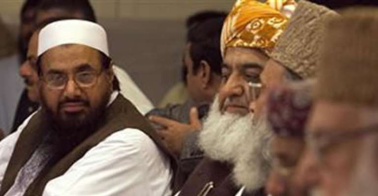 HAFIZ SAEED (L), THE HEAD OF JAMAAT-UD-DAWA AND FOUNDER OF LASHKAR-E-TAIBA, ATTENDS A CONFERENCE FOR ''SAFEGUARDING THE HONOUR OF THE PROPHET MOHAMMAD'', WITH OTHER POLITICAL AND RELIGIOUS LEADERS IN ISLAMABAD SEPTEMBER 26, 2012.