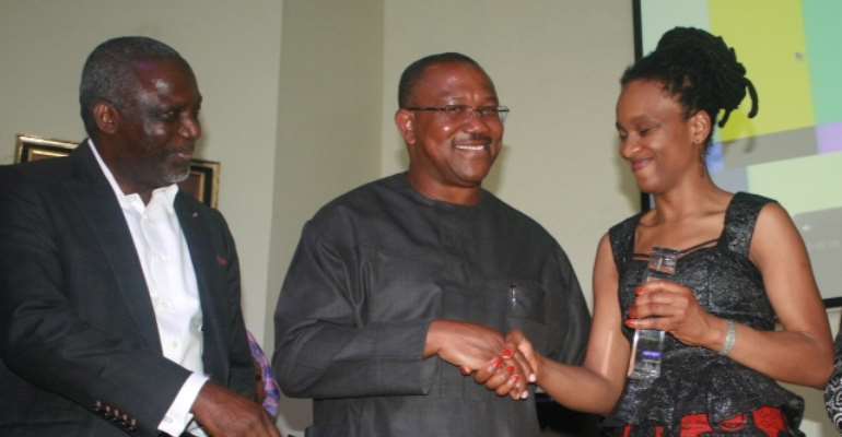 Chika Unigwe (right), with Gov. Obi (middle) and Prof. Barth Nnaji (left), receiving the award of the winner of the 2012 LNG Pr