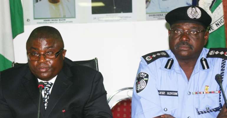 PHOTO: L-R: NEW ACTING POLICE IG, HAFIZ RINGIM AND FORMER IG, MR OGBONNAYA ONOVO.