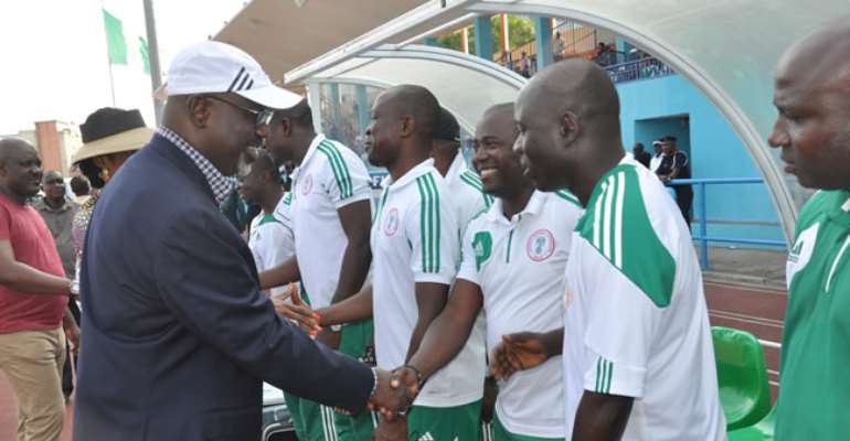 CROSS RIVER STATE GOVERNOR, SEN LIYEL IMOKE, EXCHANGING PLEASANTRIES WITH TECHNICAL CREW OF THE NIGERIAN U-17 , THE GOLDEN EAGLETS DURING THE TEAM'S INT'L FRIENDLY ENCOUNTER WITH BOTSWANA U-17 TEAM AT THE U J ESUENE STADIUM IN CALABAR. MARCH 02, 2013