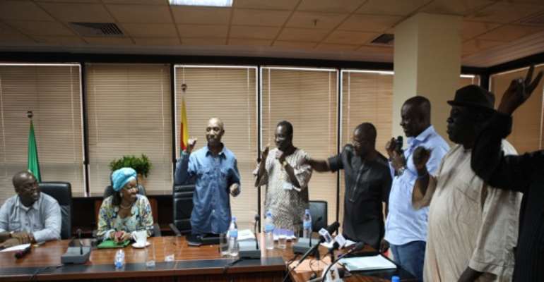 OIL WORKERS' UNION REPRESENTATIVES WITH REPRESENTATIVES OF THE FEDERAL GOVERNMENT INSIDE THE MEETING AT THE OFFICE OF THE MINISTER OF PETROLEUM RESOURCES IN ABUJA ON SATURDAY, JULY 23, 2011.