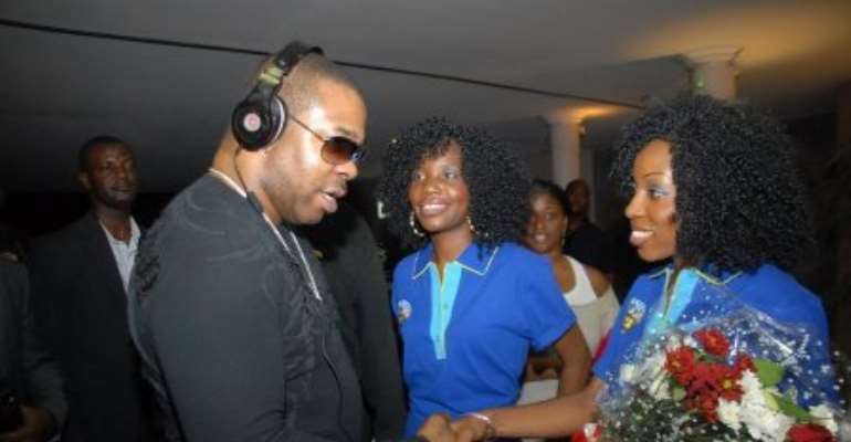 Hostesses welcome Busta Rhymes to Nigeria last Tuesday....