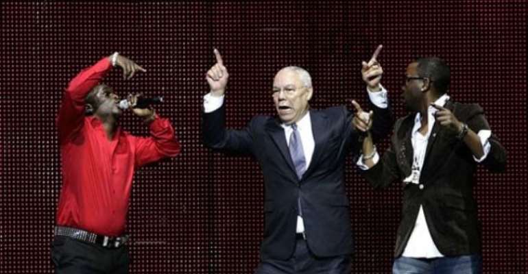 PHOTO: COLIN POWELL SINGS AND DANCES TO 'YAHOOZEE' ALONGSIDE NIGERIAN ARTISTES OLU MAINTAIN AT THISDAY'S ARISE MAGAZINE LAUNCH IN LONDON IN OCTOBER 2008. PHOTO: YUI MOK/PRESS ASSOCIATION.
