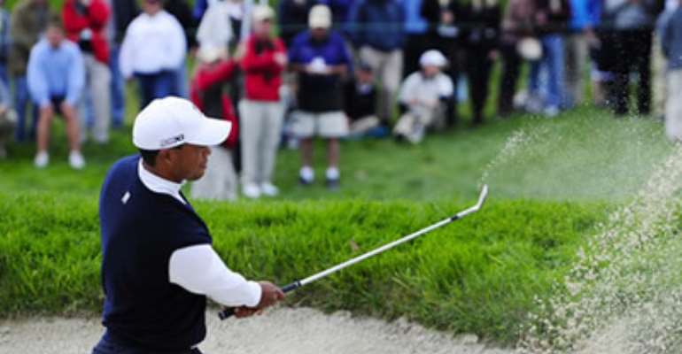 TIGER WOODS: SUFFERED BUNKER TROUBLE AT THE SECOND HOLE WHICH LED TO A BOGEY