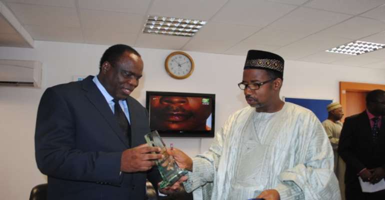 PHOTO: R-L; FCT MINISTER, SENATOR BALA ABDULKADIR MOHAMMED PRESENTS A GIFT TO VISITING ZAMBIAN HIGH COMMISSIONER TO NIGERIA, MR. ALEXIS CADMAN LUHILA, DURING A COURTESY VISIT TO THE MINISTER IN ABUJA TODAY, AUGUST 25, 2010.