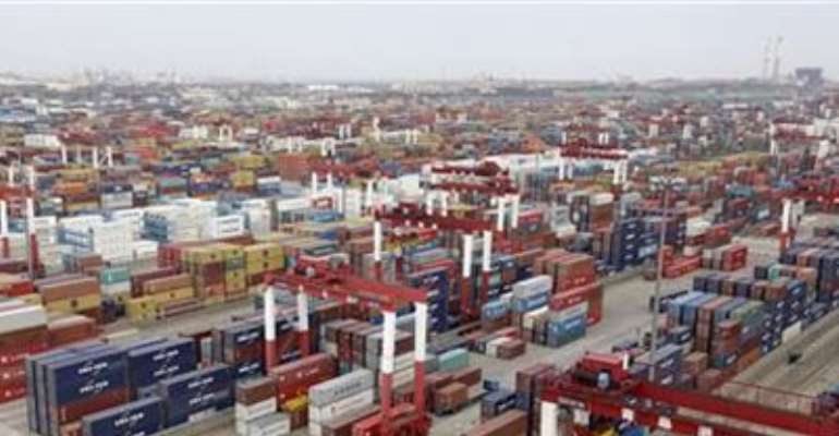 TRUCKS ARE DRIVEN INTO A SHIPPING CONTAINER AREA AT QINGDAO PORT , SHANDONG PROVINCE IN THIS SEPTEMBER 2, 2011