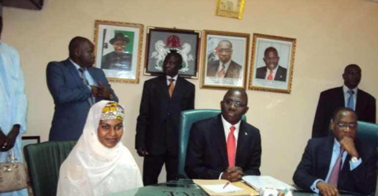 PHOTO: NEW MINISTER OF STATE FOR FINANCE, HAJIA YABAWA LAWAN WABI (L); MR. REMI BABALOLA (M) AND FINANCE MINISTER, MR OLUSEGUN AGANGA DURING THE HANDOVER CEREMONY AT THE MINISTRY OF FINANCE TODAY, AUGUST 11, 2010.