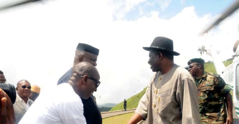 PRESIDENT GOODLUCK EBELE JONATHAN AND CROSS RIVER STATE GOVERNOR, SENATOR LIYEL IMOKE EXCHANGE PLEASANTRIES AS THE PRESIDENT SHAKES S.A. TO GOVERNOR IMOKE, MR NZAN OGBE DURING THE PRESIDENT'S ONE WEEK BREAK AT THE OBUDU RESORT.