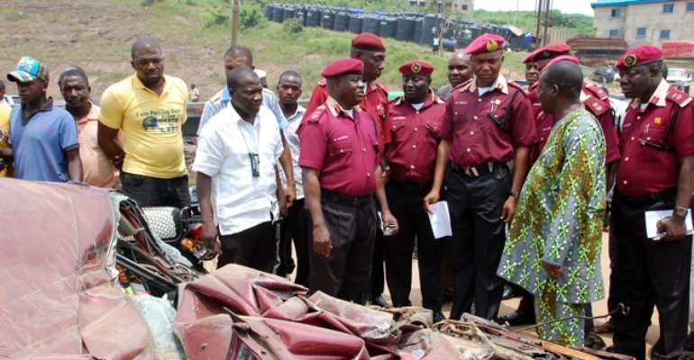 ROAD SAFETY BOSS OSITA CHIDOKA ALONGSIDE OFFICIALS OF THE FEDERAL ROAD SAFETY COMMISSION INSPECTING THE SCENE OF A MULTIPLE AUTO CRASH WHERE MANY DIED IN KUGBO, ABUJA TWO DAYS AGO.