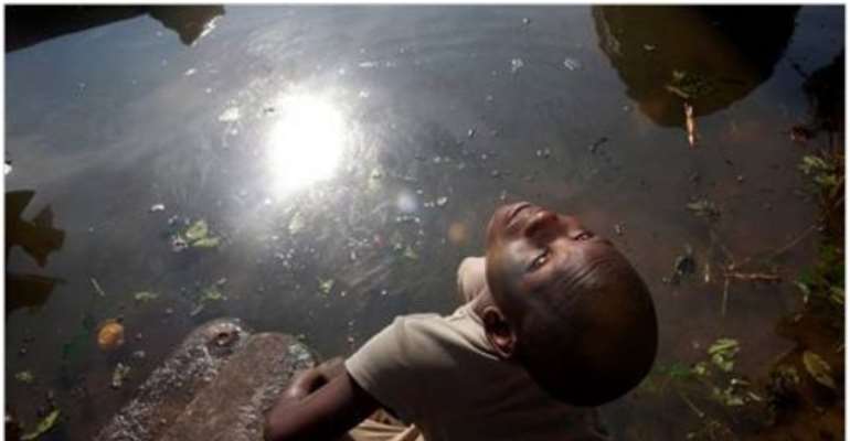 Jane Hahn for The New York Times
A boy playing by Bodo Creek in Bodo, Nigeria. As many as 546 million gallons of oil spilled into the Niger Delta over the last five decades, experts said.
