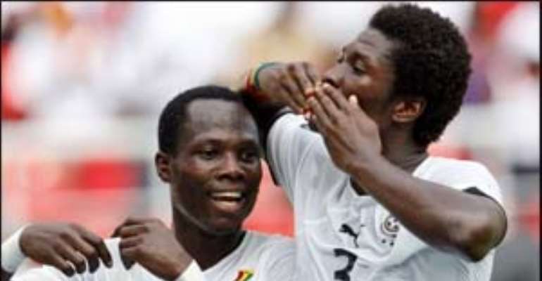 Asamoah Gyan celebrates his lone goal with Agyemang Badu