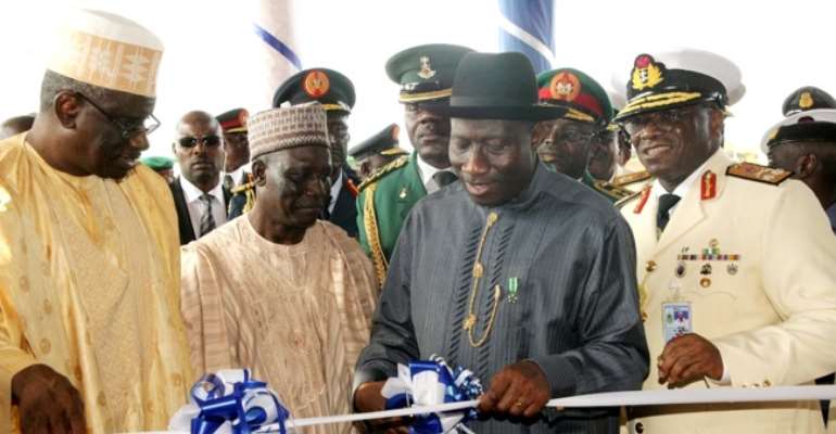PRESIDENT JONATHAN CUTS A TAPE AT THE NDA PASSING OUT PARADE ON SATURDAY, SEPTEMBER 17, 2011.