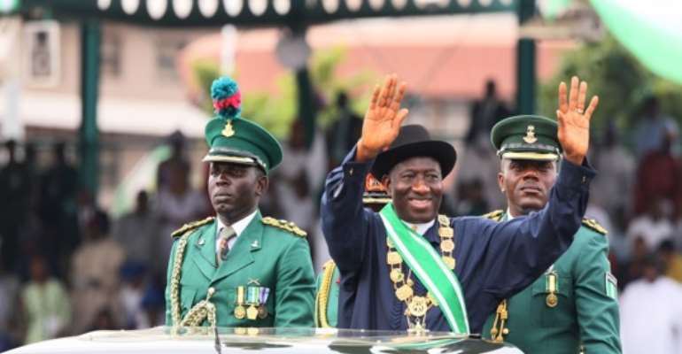 PRESIDENT GOODLUCK EBELE JONATHAN SALUTES SPECTATORS AFTER HIS SWEARING-IN AT THE EAGLE SQUARE ABUJA ON MAY 29, 2011.